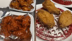 Sauced up chicken wings, and red velvet waffles topped with fried chicken