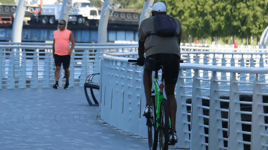a bicyclist riding on the Riverwalk