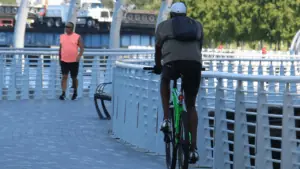 a bicyclist riding on the Riverwalk