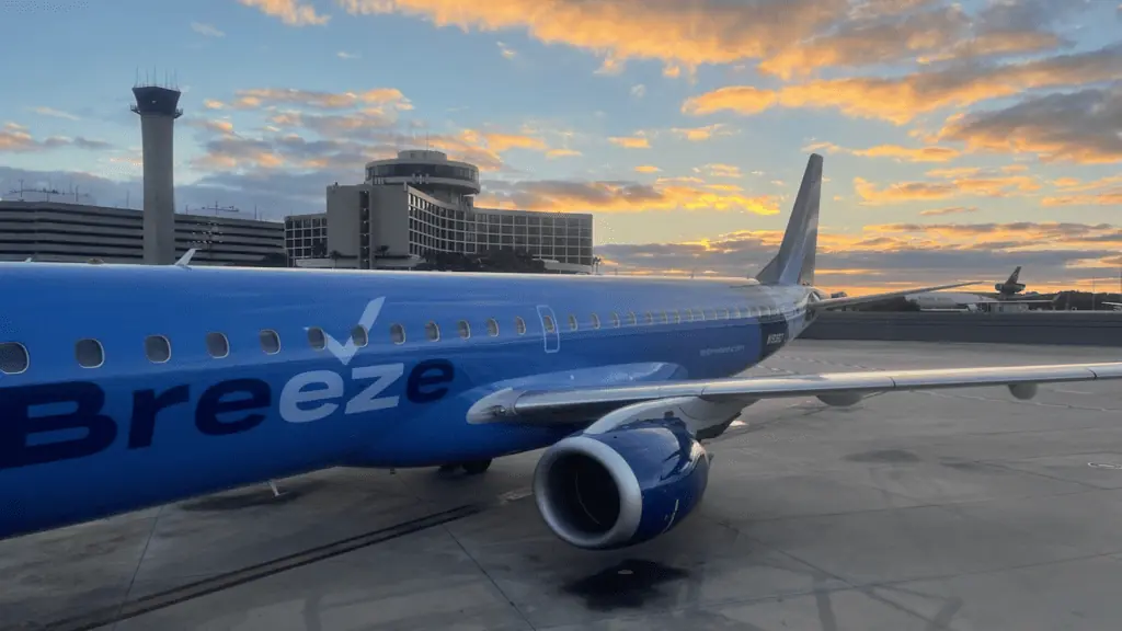 Airplane on a runway at sunset