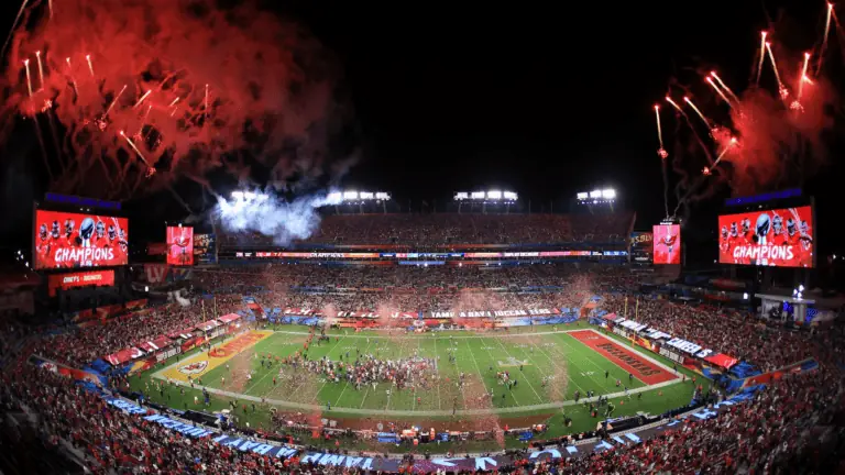 inside a football stadium with fireworks going off