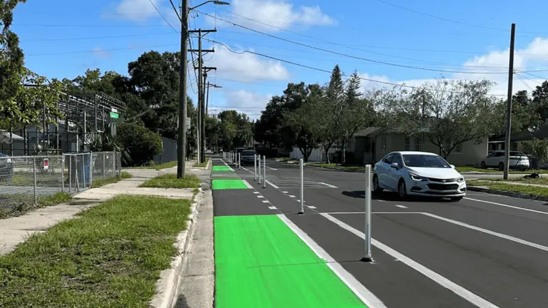 New protected green lanes with white barriers on the road