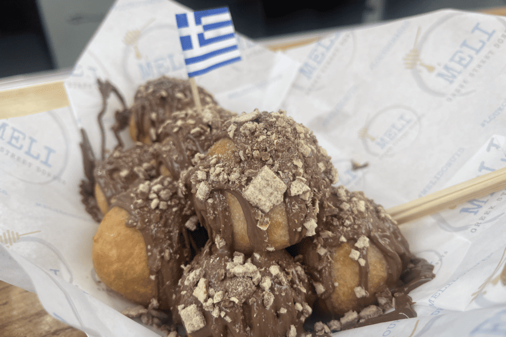 donuts drizzled with chocolate in a basket