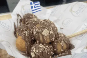donuts drizzled with chocolate in a basket