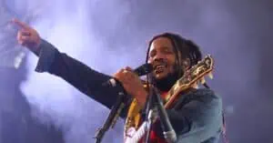 Stephen Marley sings into a microphone