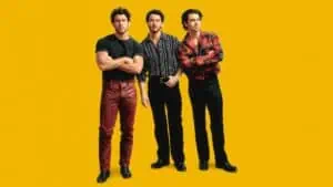 the Jonas Brothers on a yellow background