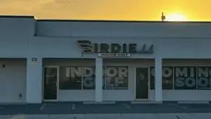 exterior of a golf bar with a sign reading Birdie over the front door.