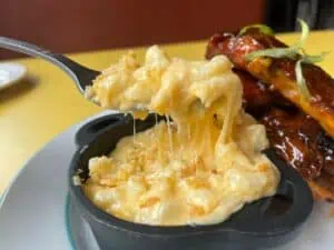 Mac and cheese being pulled from a small bowl