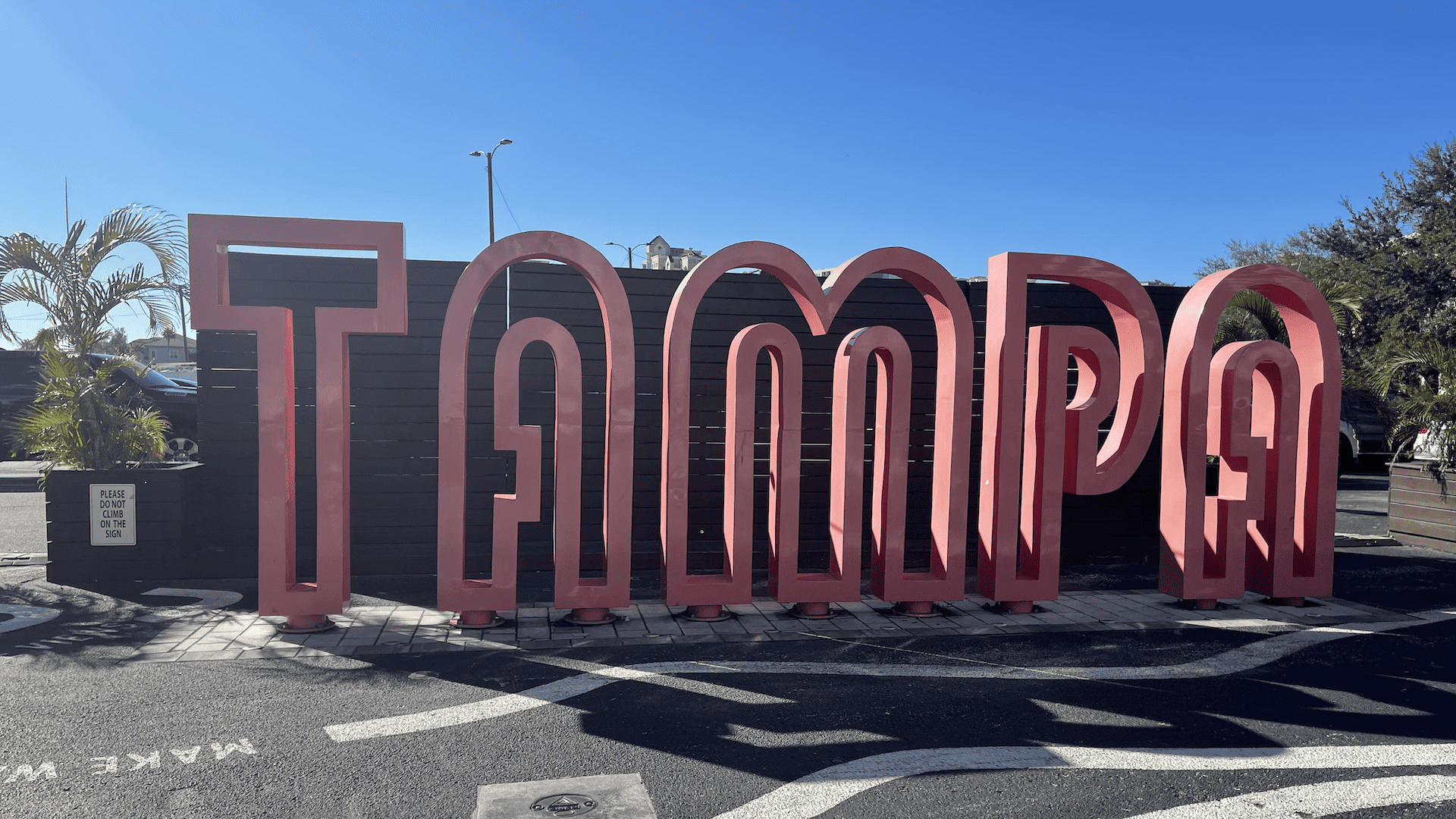 a large pink sign that reads Tampa on the waterfront.