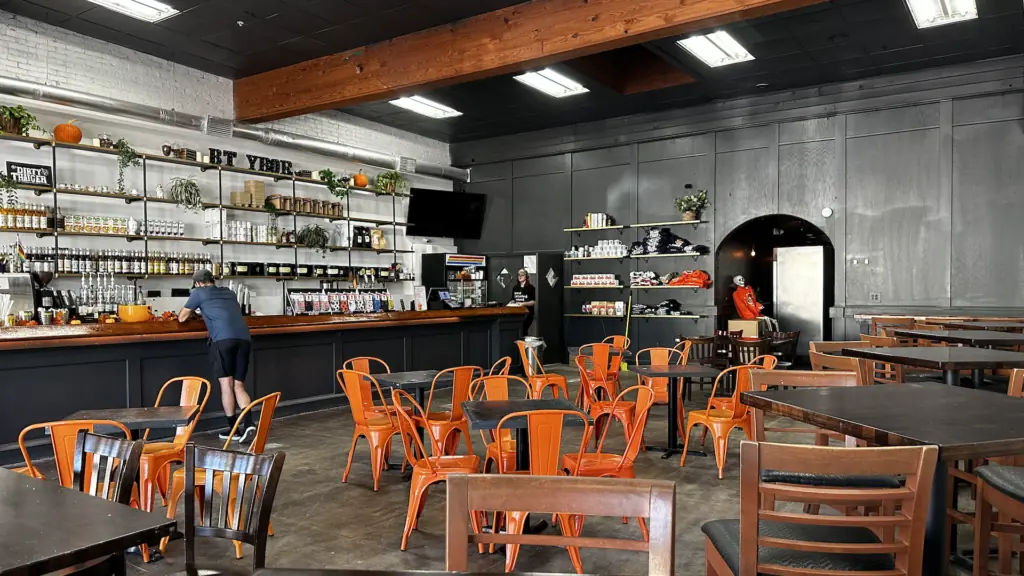 interior of a cafe with orange seating