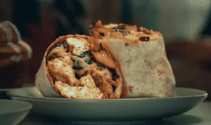 Breakfast burrito presented on a plate