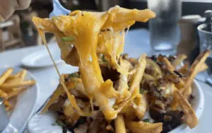 cheesy fries topped with savory pork and peppers