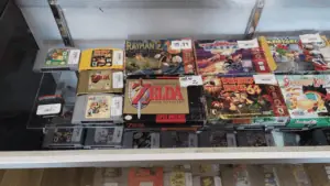 collection of classic games in boxes behind a glass case