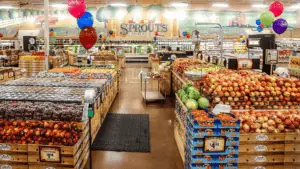interior of a grocery store with produce on both sides of the store