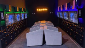 inside a gaming lounge with 12 chairs facing different screens