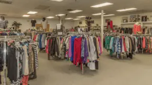 clothes on racks in a thrift shop