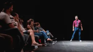 An improv performer on stage