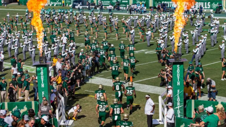 USF Football players running onto the field