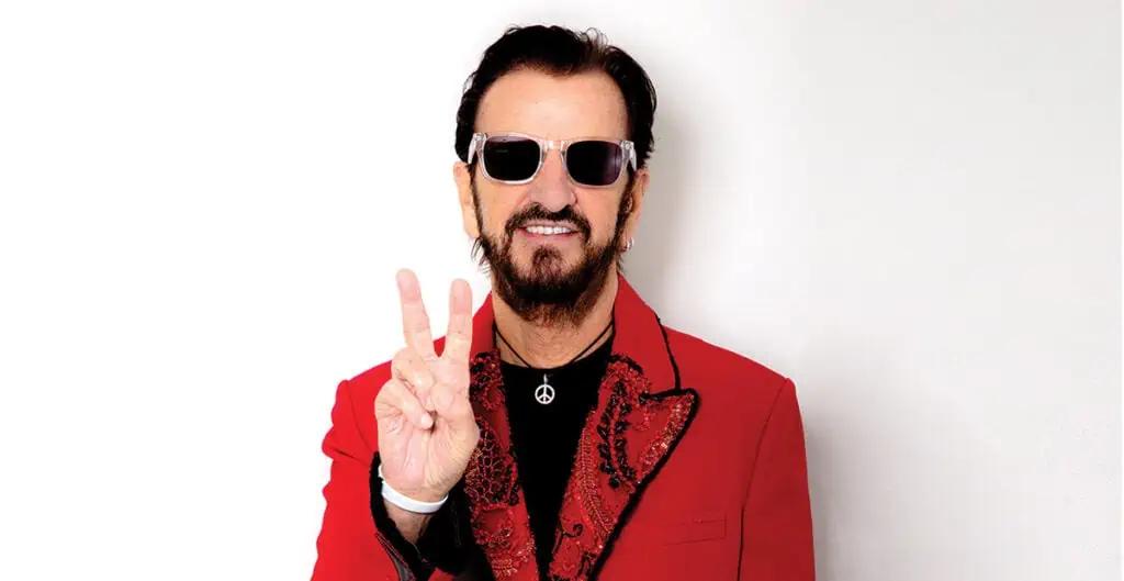 ringo starr doing the peace sign