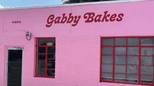 pink building with "Gabby Bakes" hand painted over the front door