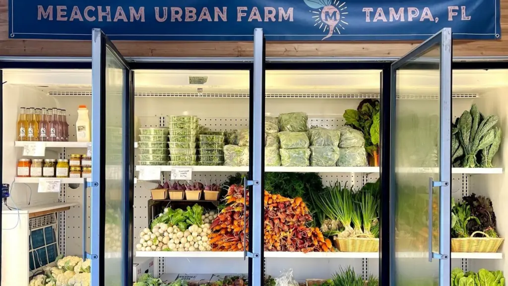 a refrigerator in a market filled with organic vegetables