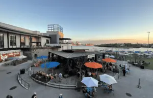 aerial view of a large outdoor food plaza at sunset