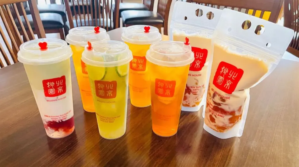 a row of colorful tea drinks