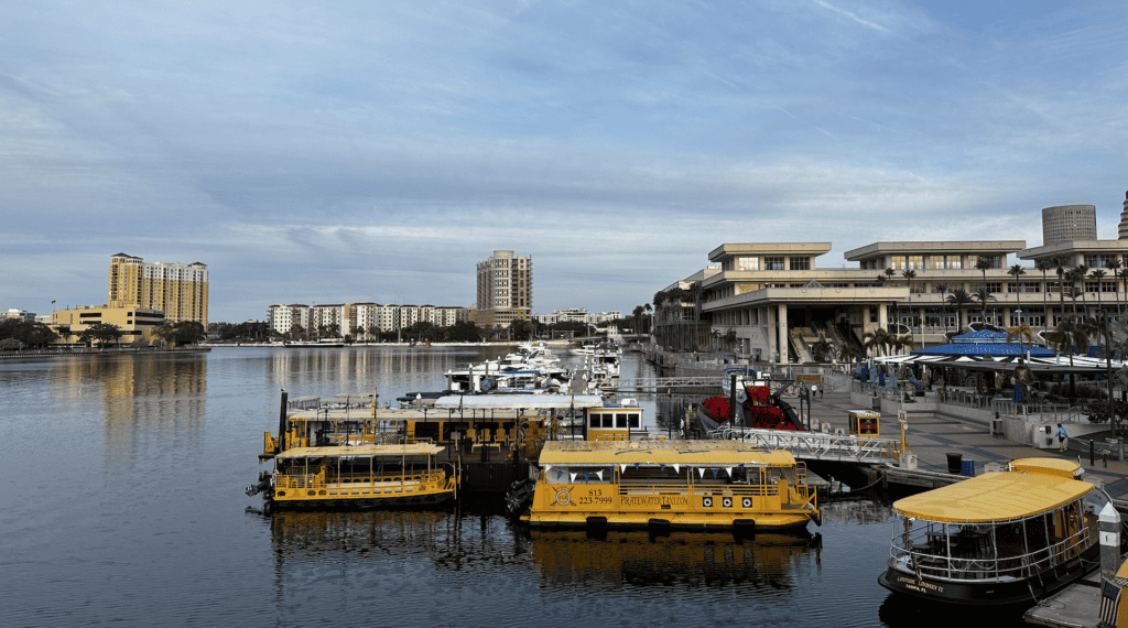 multiple yellow water taxis in the water