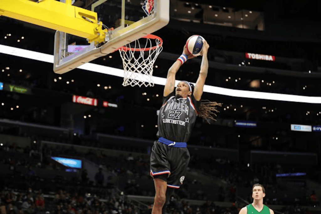 a basketball player rises for a dunk