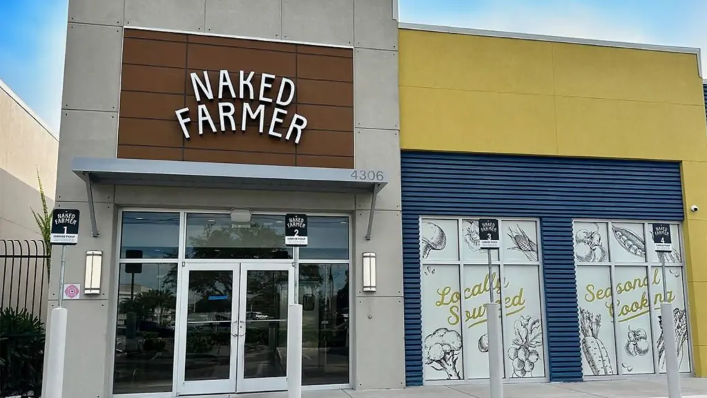 exterior of a restaurant with wood paneling over the front door