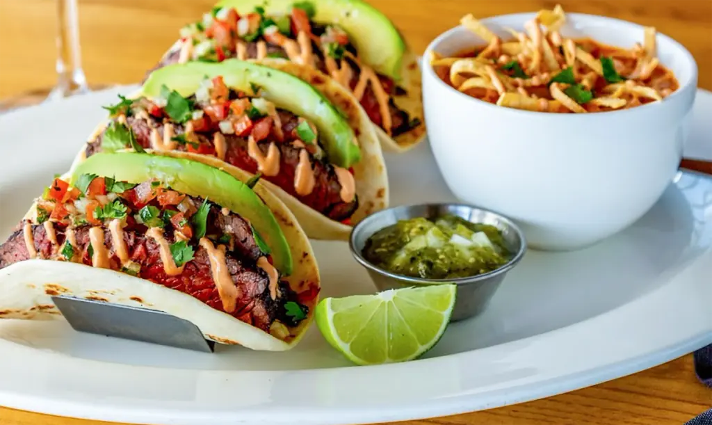 tuna tacos on a plate with avocado
