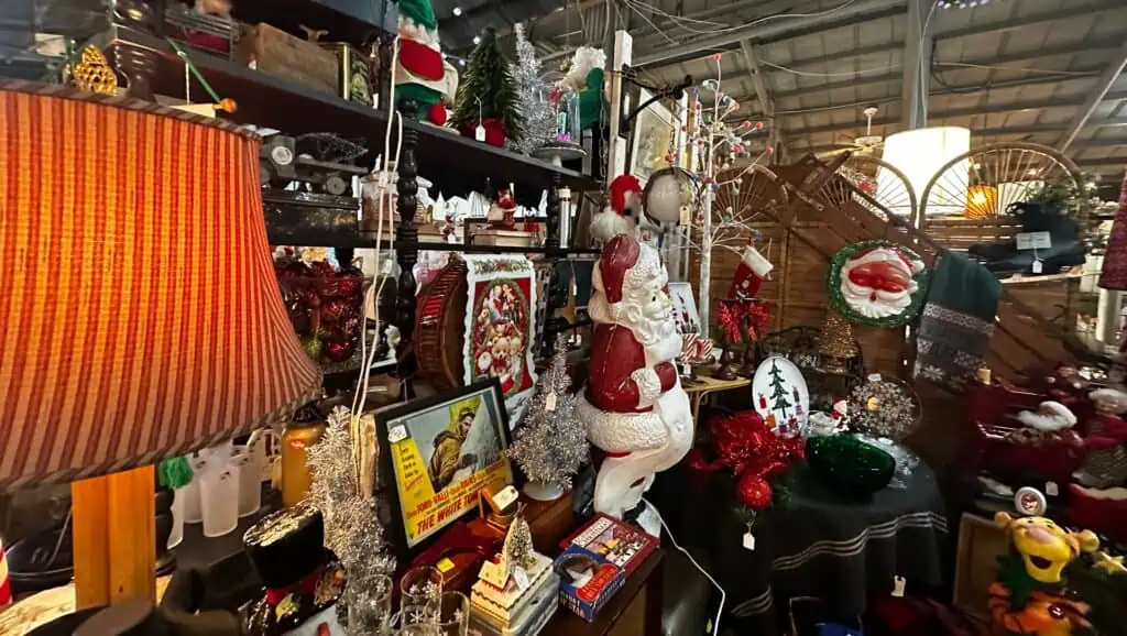 holiday decorations arranged on shelves inside a warehouse