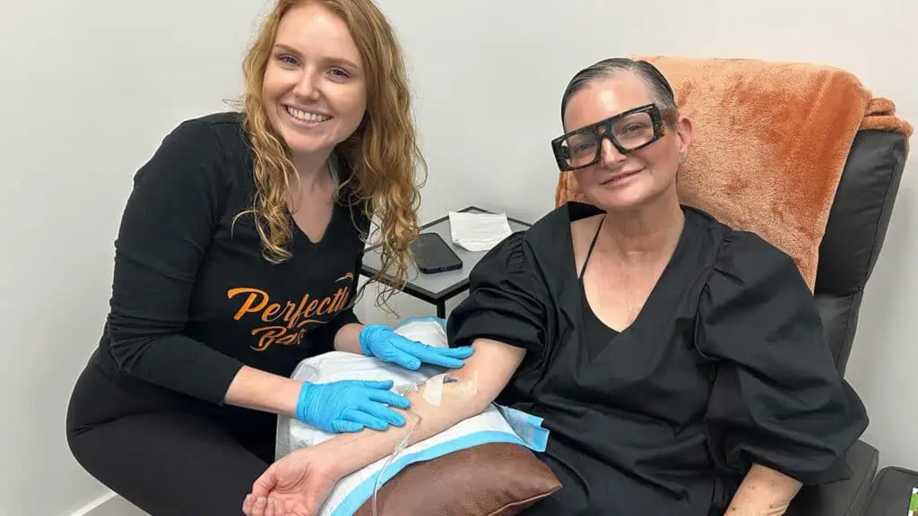 A client receives an IV therapy treatment at perfectly bare laser