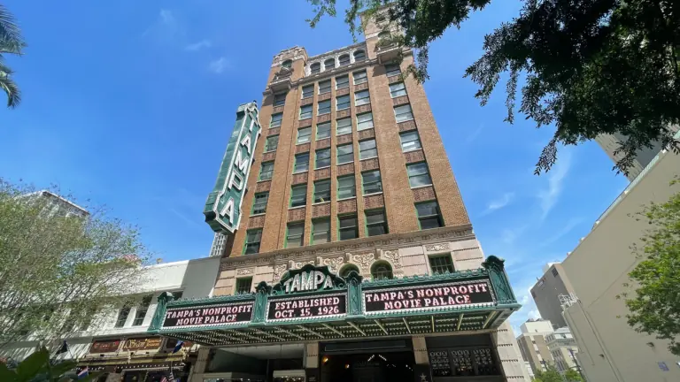 exterior of a movie theatre with a huge Tampa sign