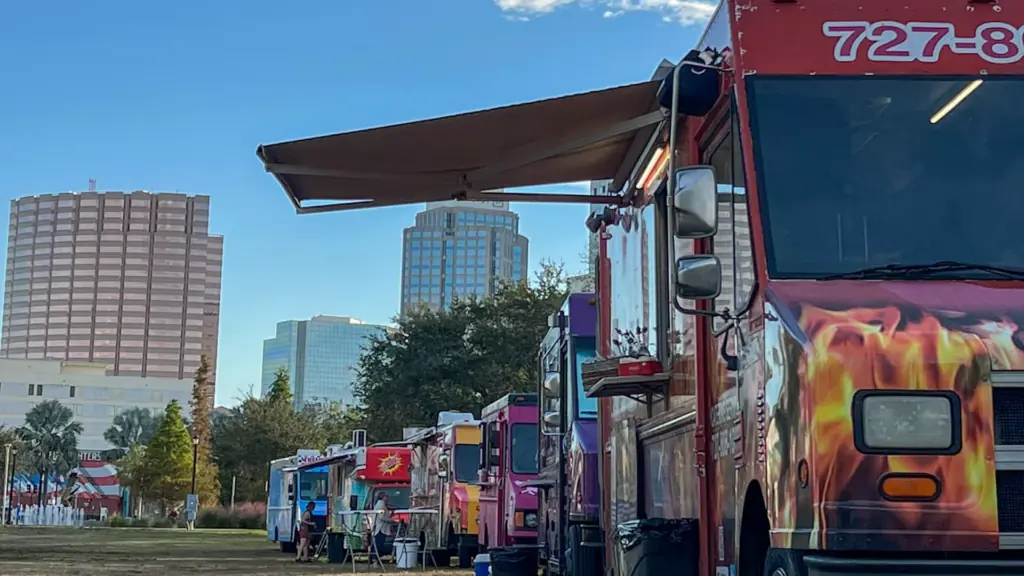 food trucks lined up at a park