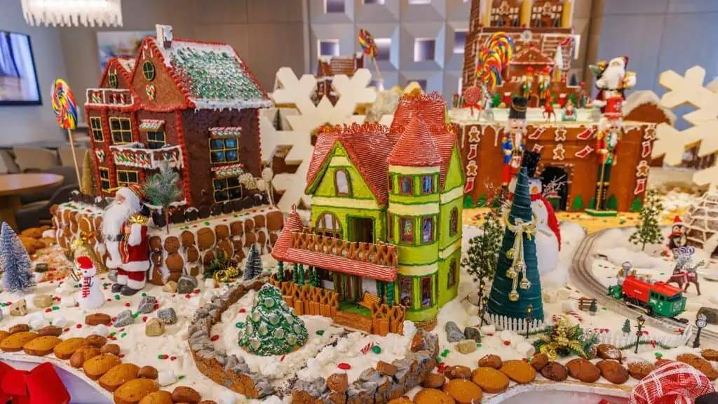 a green village house in a big gingerbread village