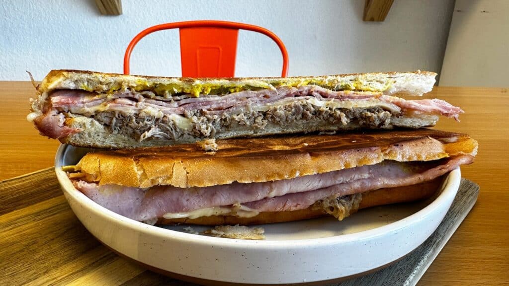 a large cuban sandwich on a plate