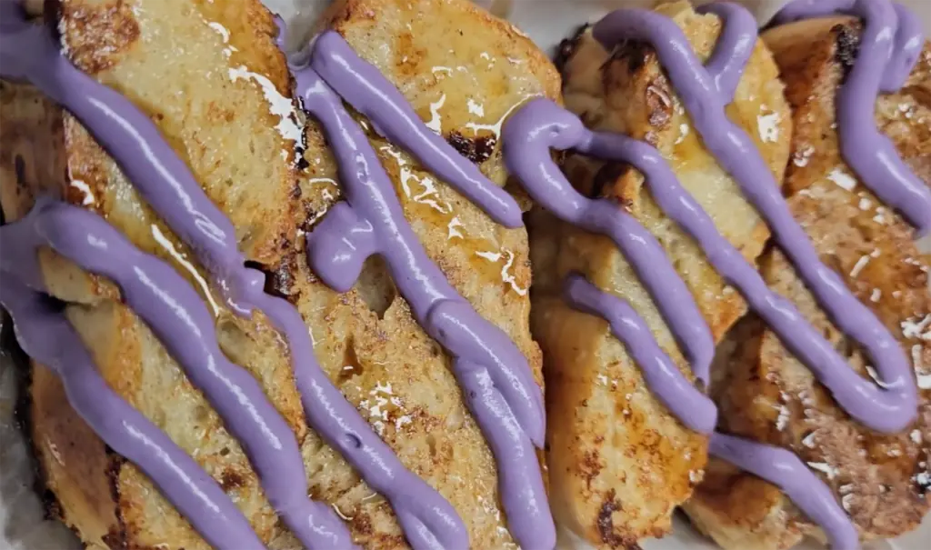 slices of cuban bread covered in a purple ube topping