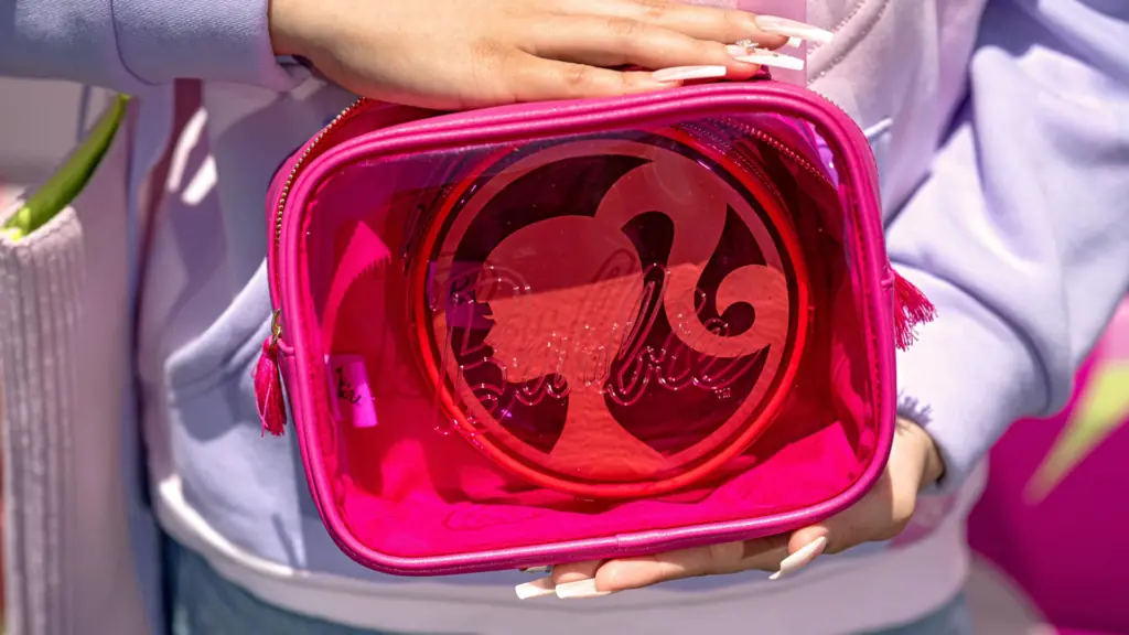 a pink handbag with the barbie logo