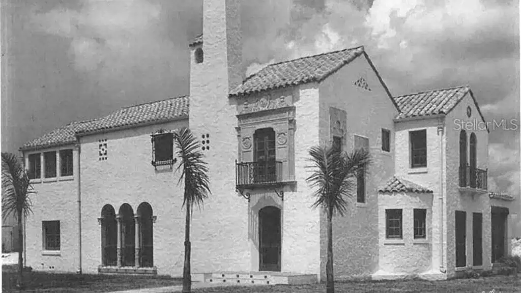 black and white photo of a castle style home