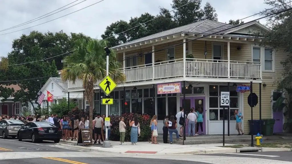 exterior of a bakery with a huge line outside