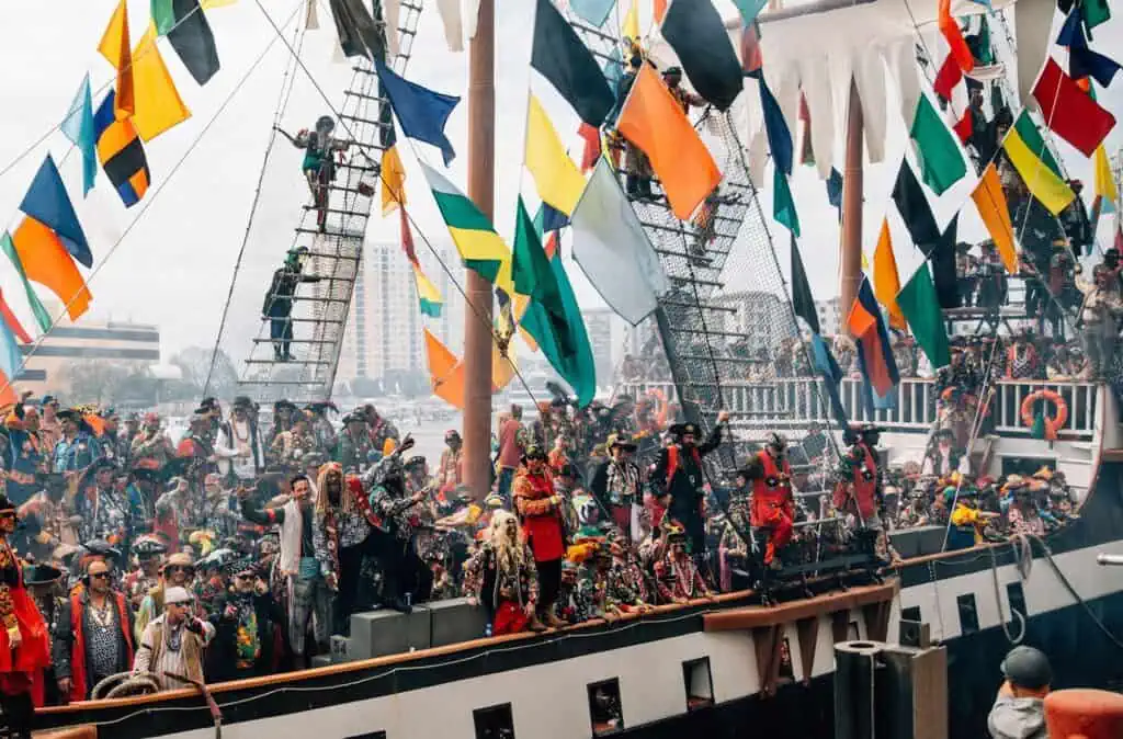 a group of people partying on a large pirate ship