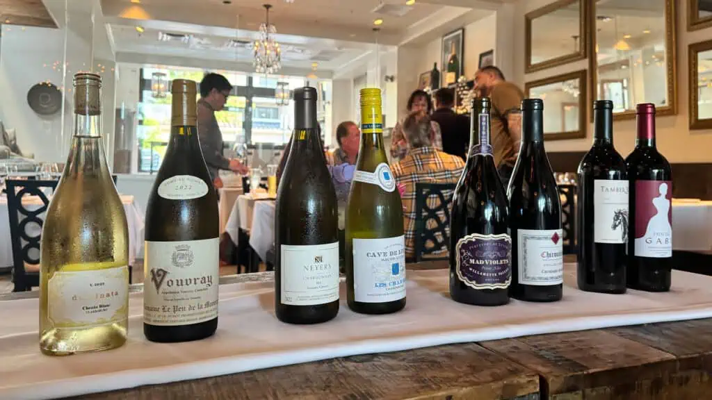 four pairs of wines side by side on a long table