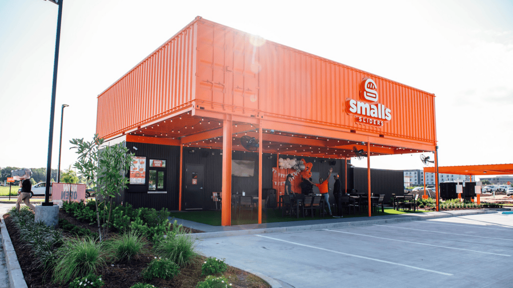 orange shipping container drive thru burger joint