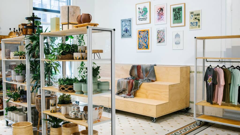 Interior lounge co working space with stacked seating options and colorful art on the walls.