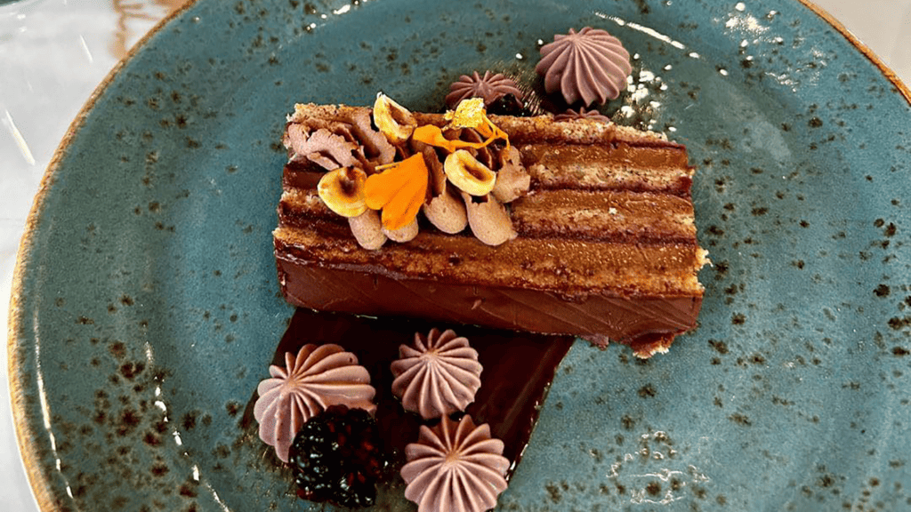a slice of chocolate cake on a blue plate