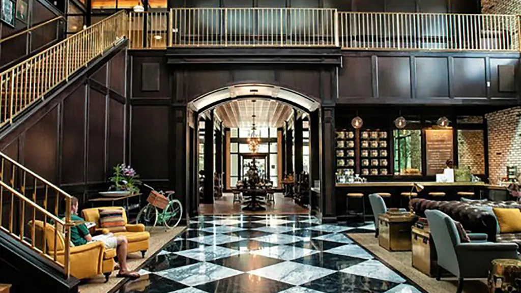 inside a cafe with black and white tiles