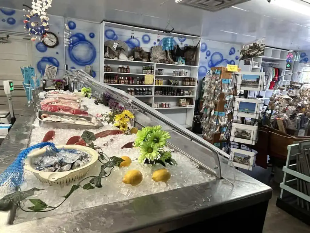 inside a seafood market with a bubble mural on the wall