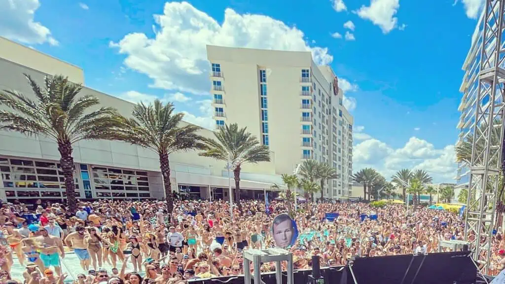 a group of people in a pool enjoying a concert