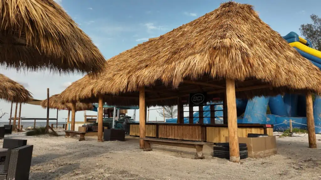 a tiki bar shade structure on an island